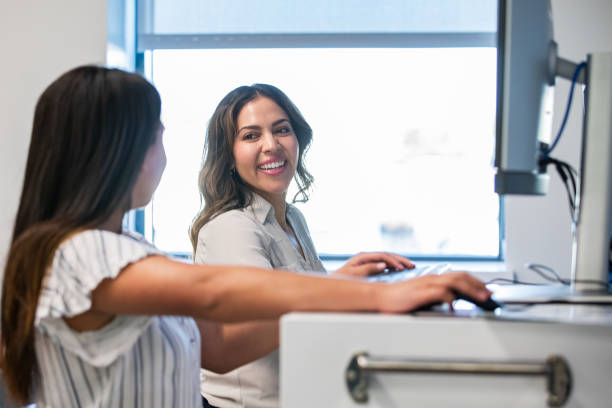 istock Woman is teaching student to use laser engraver in makerspace during STEM class 2170228702