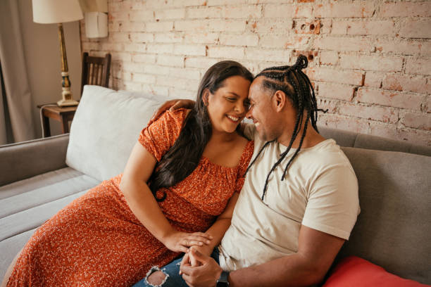 istock Couple together on the sofa in a loving moment 2170229112