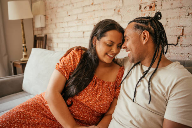 istock Couple together on the sofa in a loving moment 2170229131
