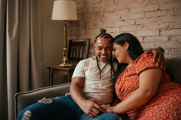 istock Couple together on the sofa in a loving moment 2170229164