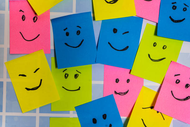 istock Conceptual image of different post-its of various colors with different smiley faces representing diversity and inclusion. 2170229183