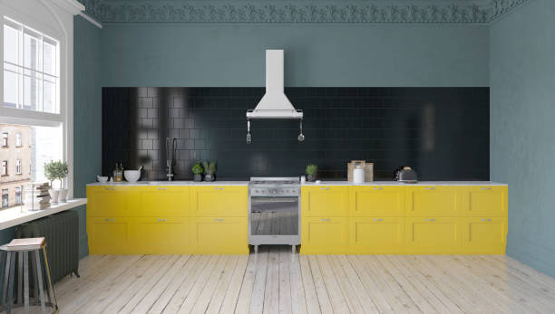 istock Modern kitchen with yellow cabinets and black backsplash. 2170229480