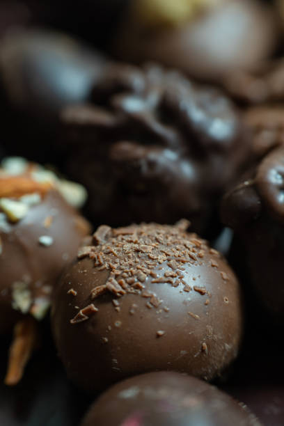 istock Close-up of some chocolate truffles covered with nuts 2170229485