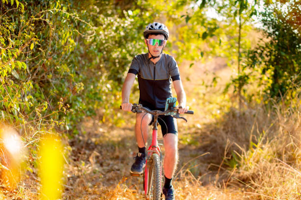 istock Cyclist riding a bike on a trail 2170232111