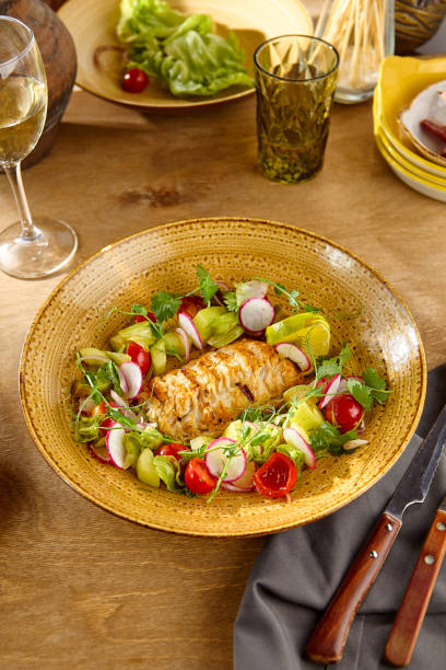 istock Sumptuous Pike Perch Tempura with Vibrant Vegetable Salad on Rustic Wooden Table 2170232205
