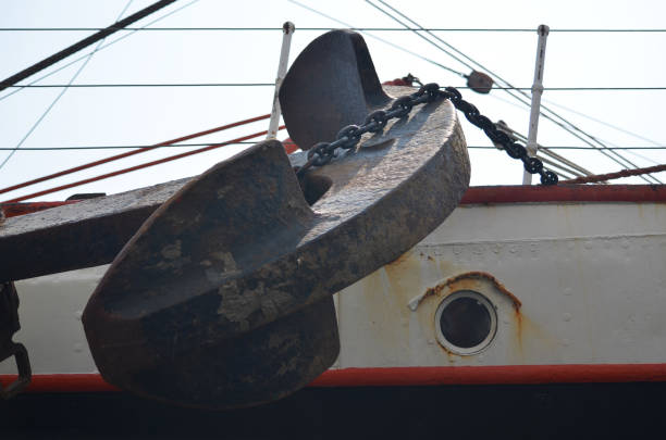 Close-up view of a wheel pulley attached to a fly boom on a commercial fishing trawler.