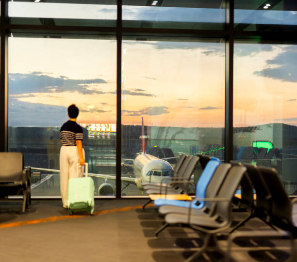 istock Traveler with suitcase in airport concept 2170242159