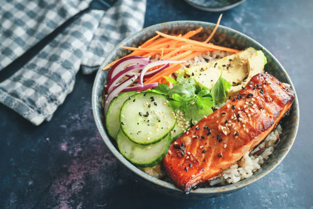 istock Spicy Salmon Bowl with Rice, Carrots, Cucumber and Avocado 2170242854