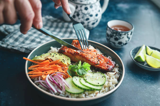 istock Spicy Salmon Bowl with Rice, Carrots, Cucumber and Avocado 2170242874