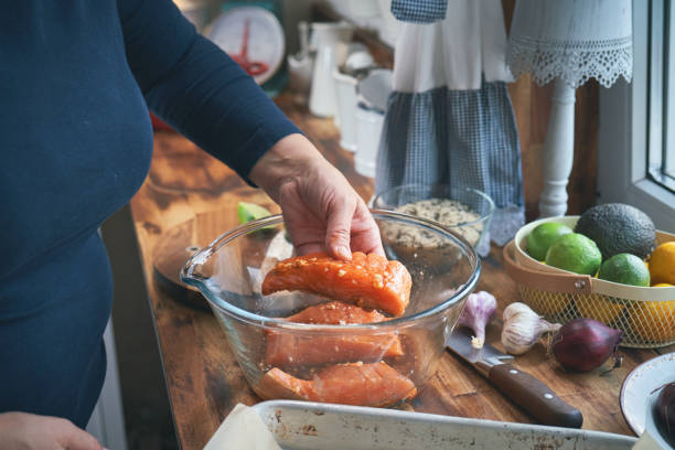 Preparing Spicy Salmon Bowl with Rice, Carrots, Cucumber and Avocado