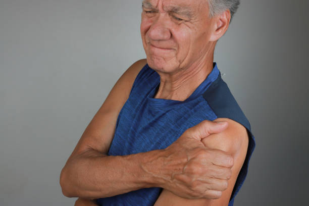 istock Man in Pain Massaging his Deltoid Muscles 2170245723