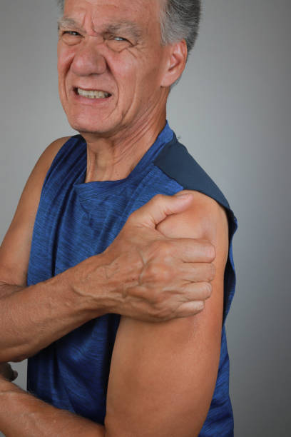 istock Man in Pain Massaging his Deltoid Muscles 2170246425