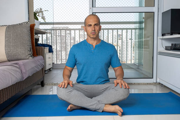istock 48 year old Brazilian man practicing yoga at his home_3. 2170246557