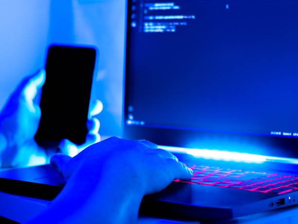 istock A person manipulating a mobile phone and a laptop 2170248262