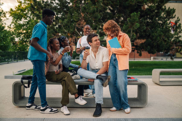 istock Happy diverse group of college students having coffee break at campus. 2170249236