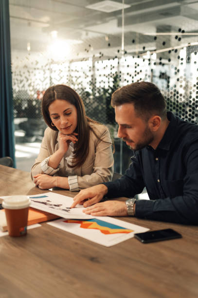 istock Marketing experts analyzing global market and charts at boardroom. 2170249485