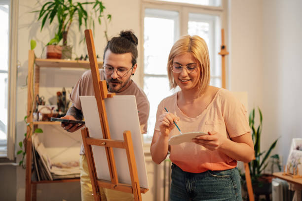 istock Affectionate artist couple painting at art studio on easel together. 2170251844