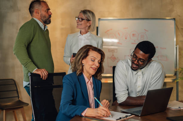 istock Diverse colleagues in a boardroom discussing business together 2170252263
