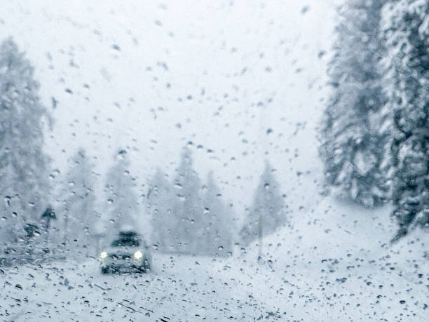 istock Driving on mountain roads covered with deep snow during a blizzard 2170255690