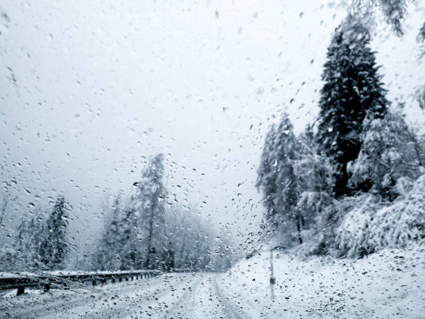 Driving on mountain roads covered with deep snow during a blizzard