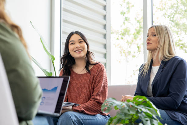 istock A pair of coworkers chat with thier manager during a feedback session. 2170257047