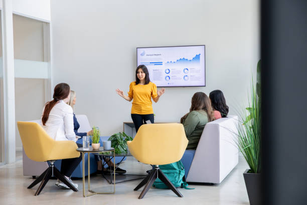 istock An HR manager leads a training session for new employees. 2170257058