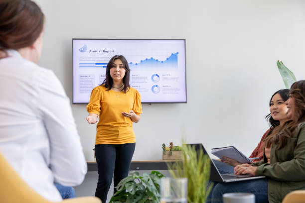 istock A team leader presents a new project plan to her team. 2170257059