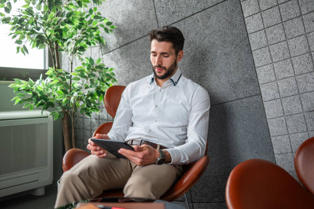 istock Confident Caucasian Businessman Using Tablet in Office 2170259110