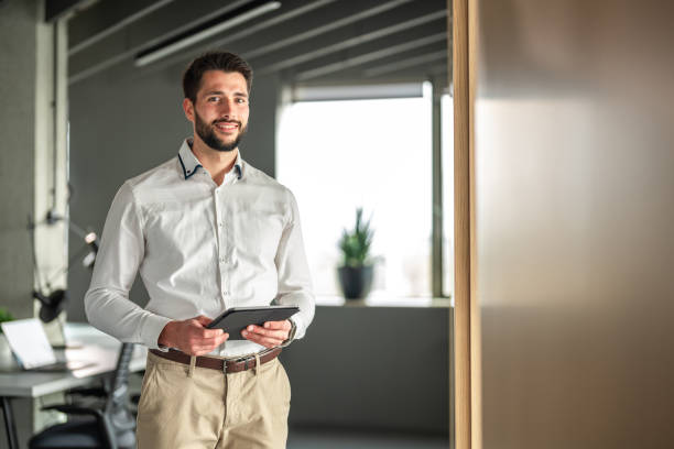 istock Confident Caucasian Businessman with Tablet in Modern Office 2170259136