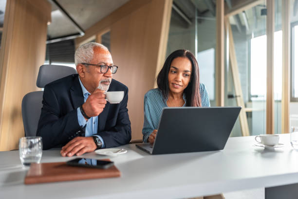 istock Diverse Senior Business Executives Working on Laptop 2170259180