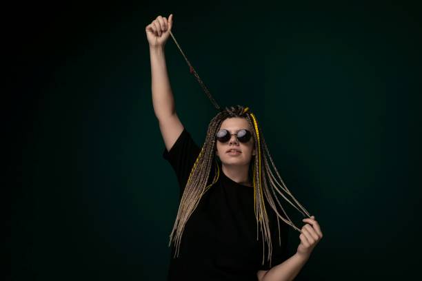 istock Woman With Dreadlocks and Sunglasses Holding a String 2170260745