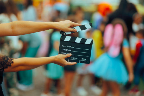 istock Event Organizer Holding a Film Slate Shooting a Party Video 2170264853