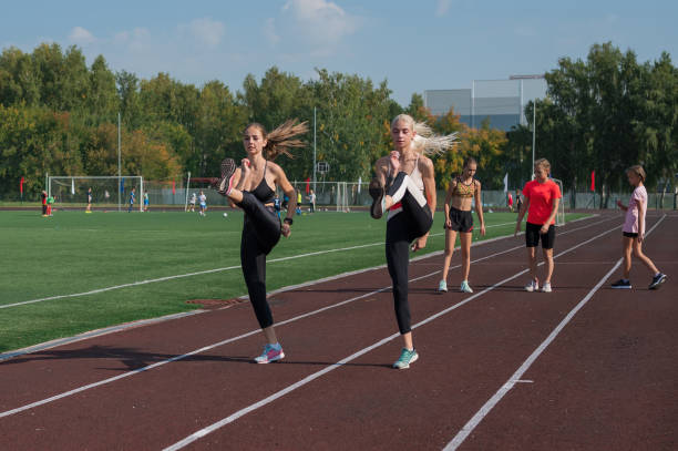istock Group of young athletes training at the stadium 2170267939