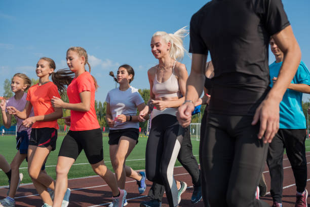 istock Group of young athletes training at the stadium 2170267950