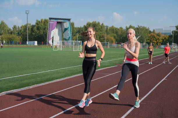 istock Group of young athletes training at the stadium 2170267962