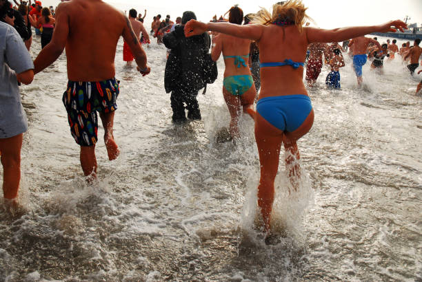 Coney Island, NY, USA January 1 A group of people celebrate the New Year by jumping into the icy cold ocean water with the Polar Bear club in Coney Island New York