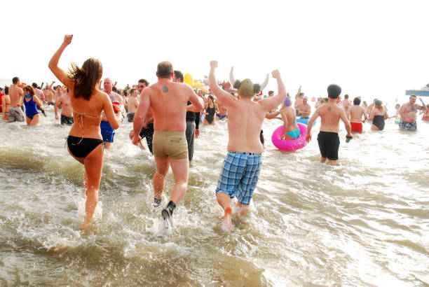Coney Island, NY, USA January 1 On New Years Day, people wear their bathing suits and jump into the cold ocean waters during the Polar Bear Plunge on Coney Island New York