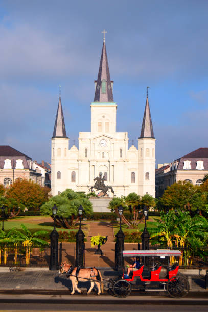 New Orleans, LA, USA October 29 A horse and carriage tour stops in front of Jackson Square and St Louis Cathedral in New Orleans, ready to begin a tour