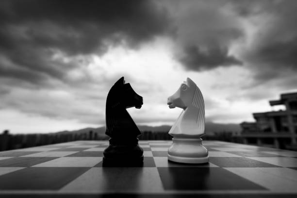 istock Two chess knights on city background 2170275410
