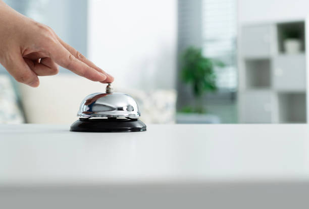 istock Woman hand ringing a service bell 2170275486