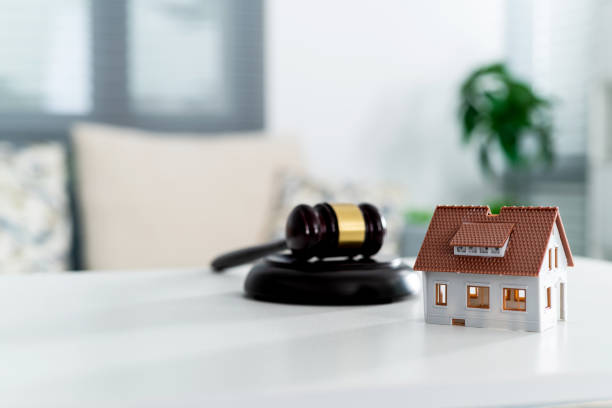Model house and gavel on the table