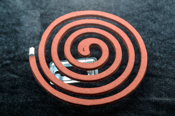 istock A mosquito coil with smoke coming out of it 2170277677