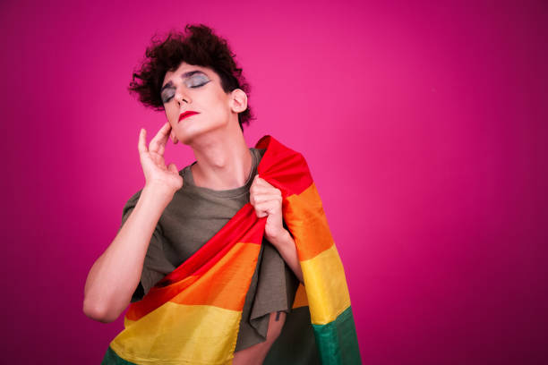 istock Funny guy dressed as a drag queen and online dating. Pink background. 2170281942