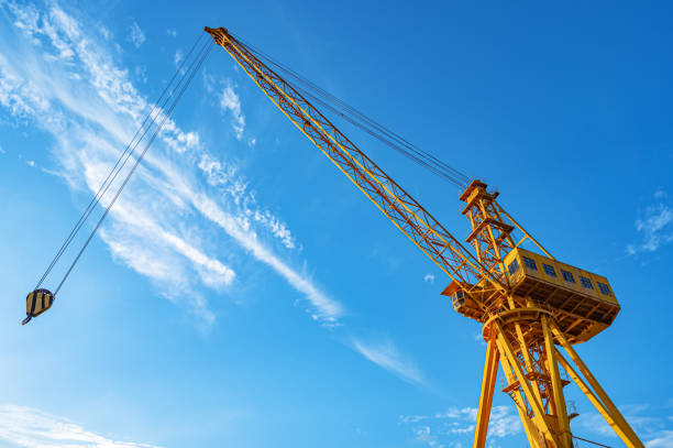 Commercial dock crane with blue sky background
