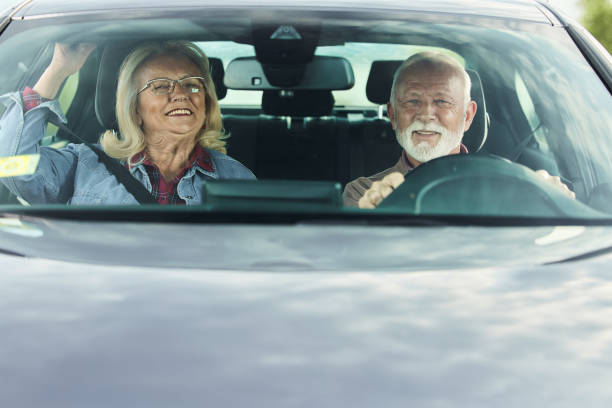 istock Happy mature couple going on a road trip by car. 2170286874