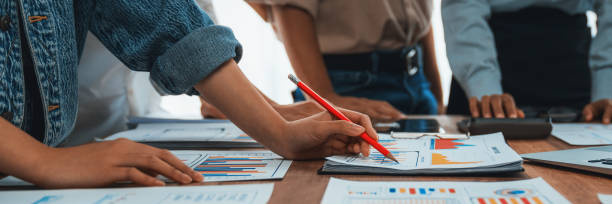istock Analyst team utilizing BI Fintech to analyze financial dashboard. Scrutinize 2170287918