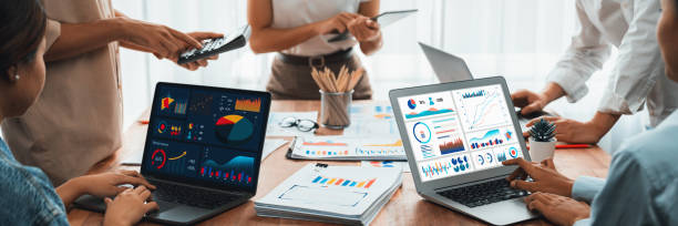 istock Analyst team utilizing BI Fintech to analyze financial report. Scrutinize 2170288171