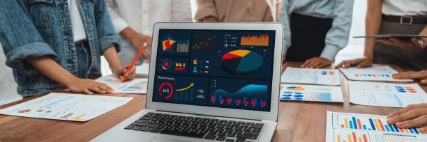 istock Analyst team utilizing BI Fintech to analyze financial report. Scrutinize 2170289798