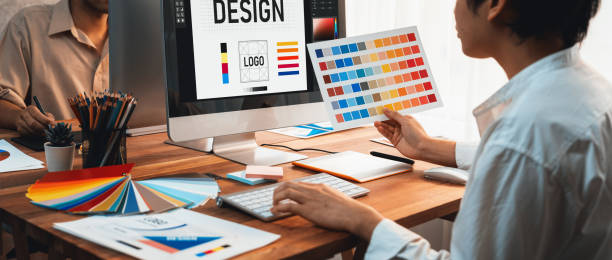 istock Graphic designer works on computer laptop with digital pen. Scrutinize 2170289889