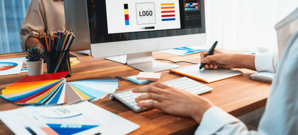 istock Graphic designer works on computer laptop with digital pen. Scrutinize 2170290060
